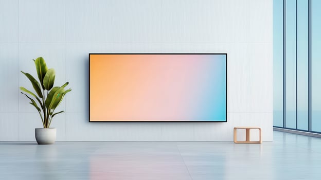 A large television screen is mounted on a wall in a room with a white wall photo