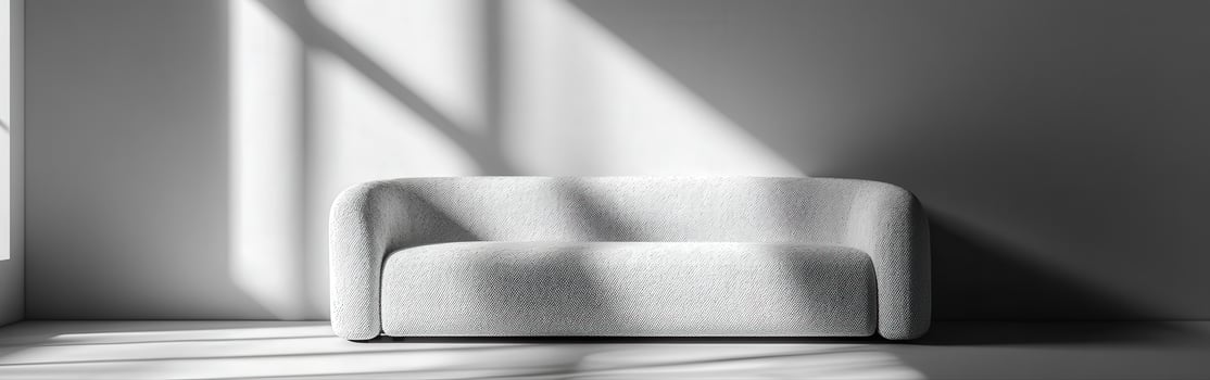 Modern boucle sofa in a sunlit minimalist interior space photo