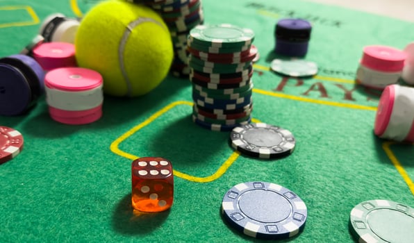 Poker chips and tennis ball photo