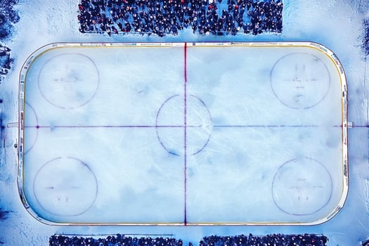 Aerial view of outdoor ice hockey rink during game photo