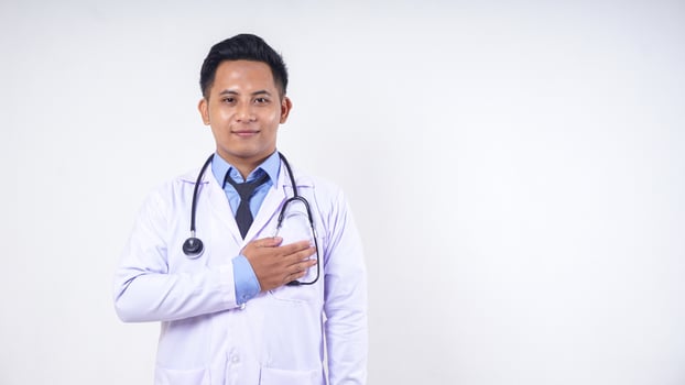 Portrait of Asian Male Doctor with Stethoscope on White Background photo