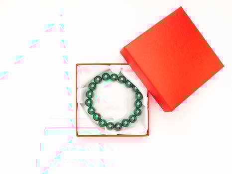 Jade bangle or bracelet in a red box on a white background photo
