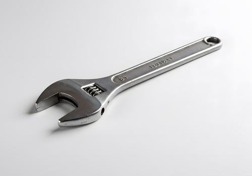 A Close-Up of an Adjustable Wrench on a White Background photo