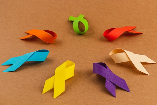 Colored awareness ribbons represent various health campaigns and causes photo