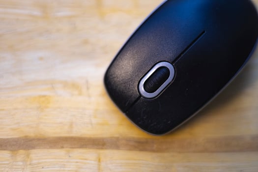 Top View Of Mouse Is Placed On The Wooden Table photo
