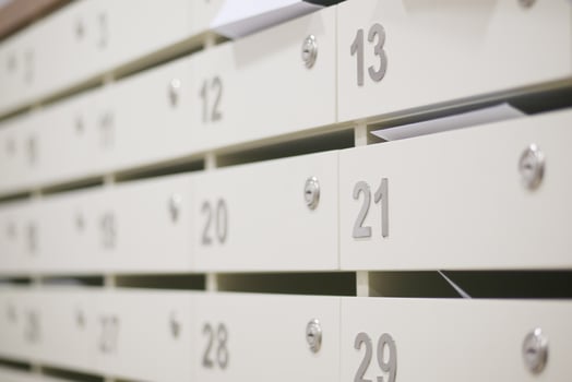 Mailbox units holding letters in a modern office environment photo