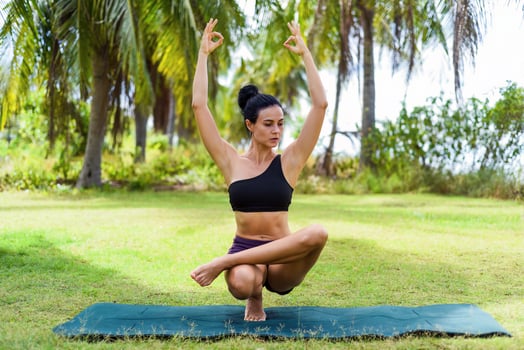 Ardha Baddha Padma or Padangusthasana Half Lotus Tip Toe Pose yoga with ukrainian woman making it photo