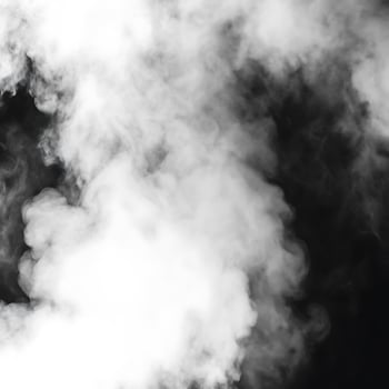 Abstract of white smoke billowing against a dark background, creating a dramatic and ethereal atmosphere with shades of gray and white photo