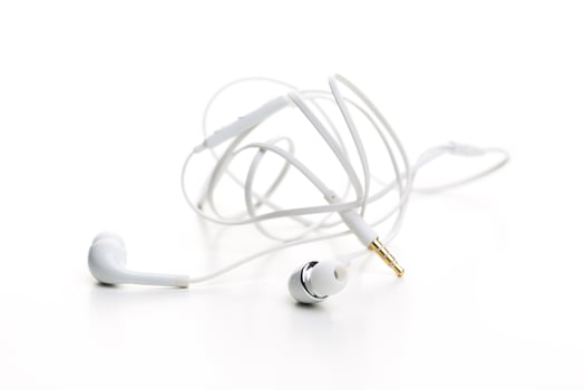 Pair of earphones close up on grey background photo