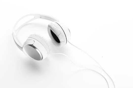 White headphones on white background close up photo