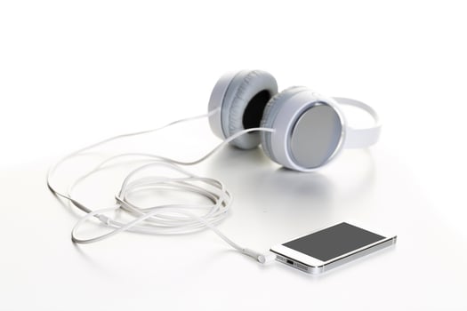 White headphones on white background close up photo