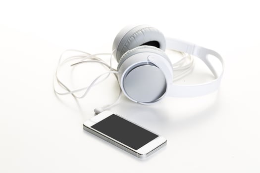 White headphones on white background close up photo