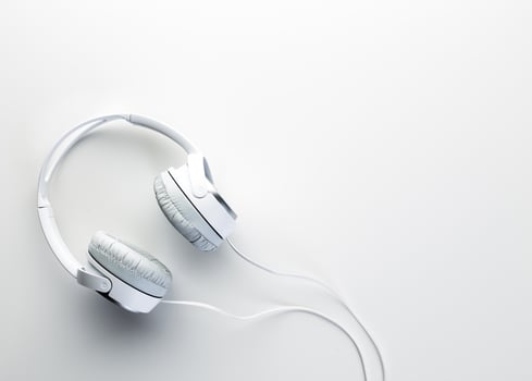White headphones on white background close up photo