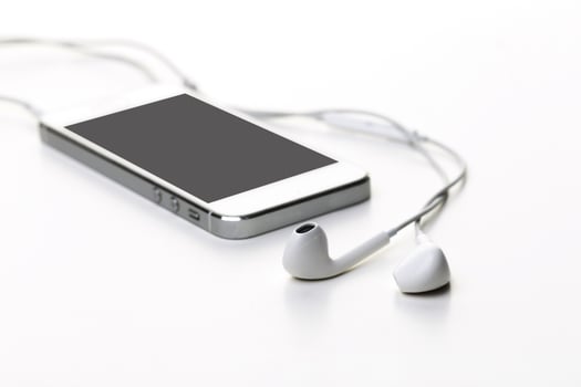 Smartphone with black screen with earphones close up photo