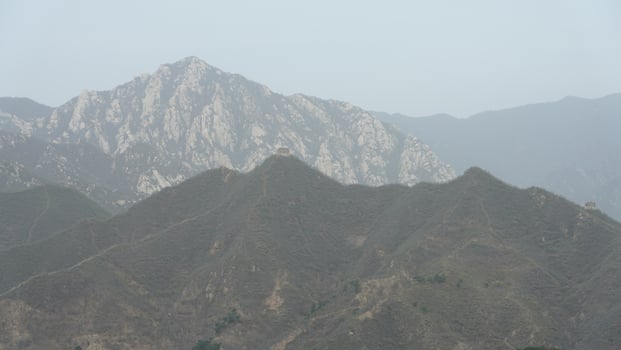 The landscape with the Great wall on the mountains photo