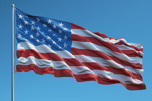 Waving American flag against a clear blue sky showcasing patriotic spirit and unity. photo