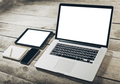 Workplace with laptop on grunge wooden background photo