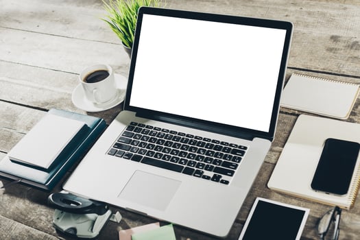 Workplace with laptop on grunge wooden background photo