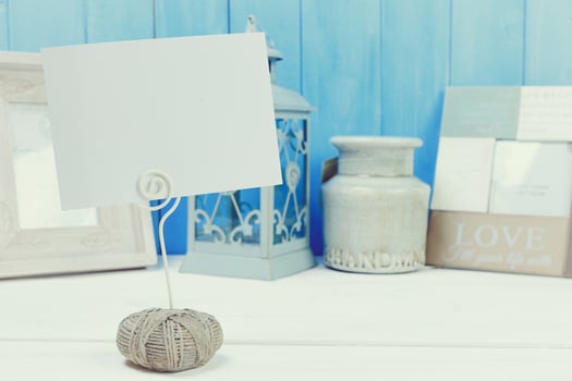 Home decor items on blue wooden background photo