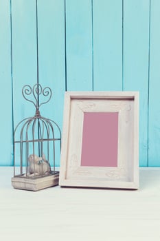 Home decor items on blue wooden background photo