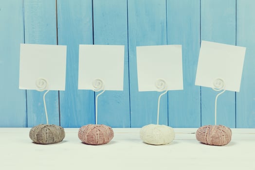 Cute home decor card holders on blue wooden background photo