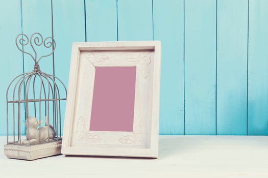 Home decor items on blue wooden background photo