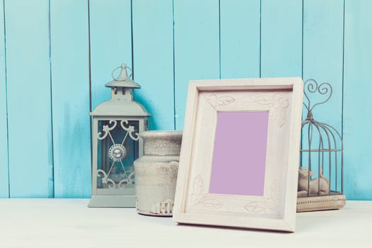 Home decor items on blue wooden background photo