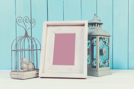 Home decor items on blue wooden background photo