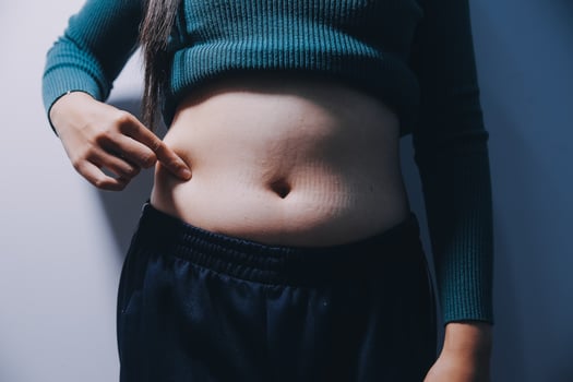 A woman with a flat stomach and a small waist photo