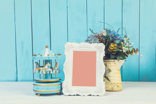 Home decor items on blue wooden background photo