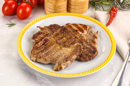 A plate of food with a knife and fork photo