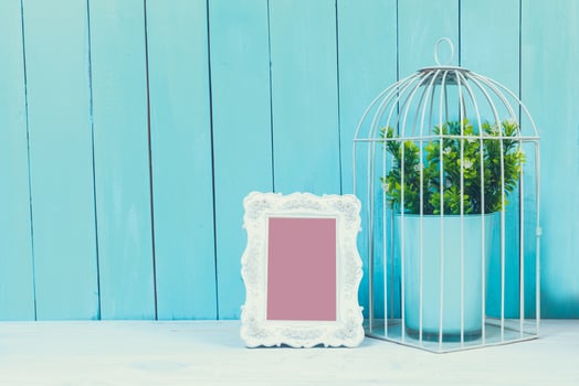 Home decor items on blue wooden background photo