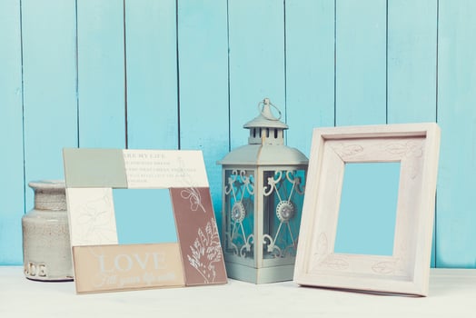 Home decor items on blue wooden background photo