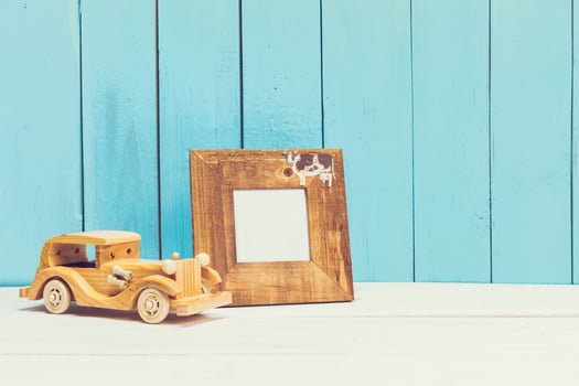 Cozy pastel wooden home decor objects on blue background photo