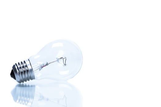 Close up of a light bulb on white background photo