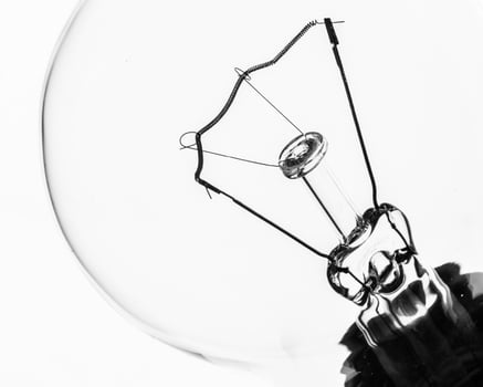 Lightbulb on white background, close up shot photo