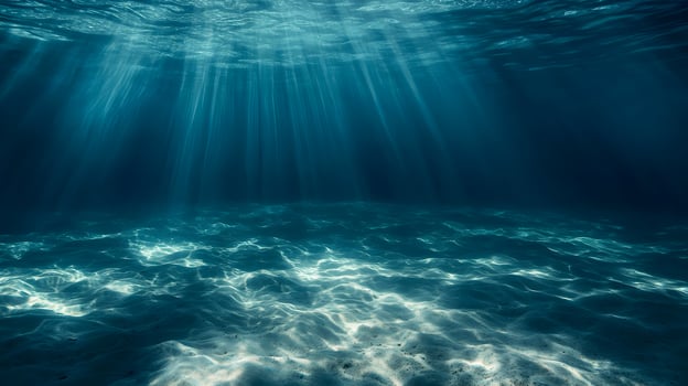 Underwater serenity a scene of sunlight filtering through deep blue sea water photo