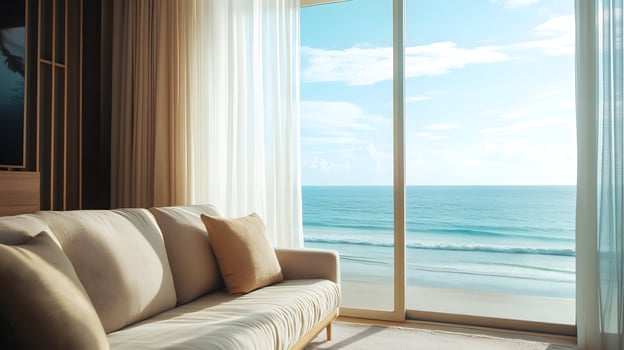 Serene beachfront living room with ocean view and natural light for relaxation photo