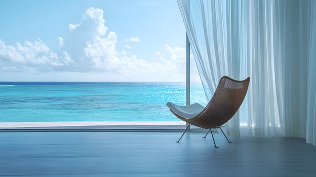 Serene Seascape View from Modern Room with Stylish Chair and Flowing White Curtains photo
