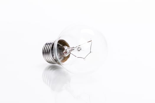 Close up of a light bulb on white background photo