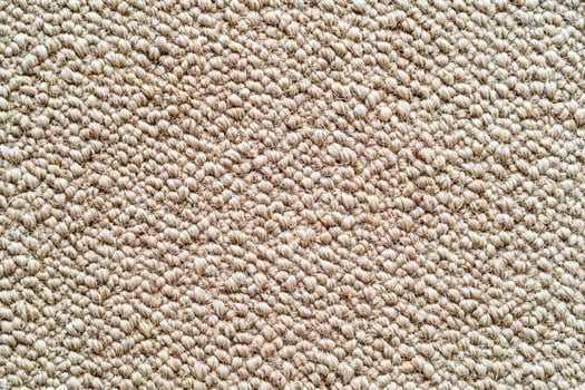 Close Up of Textured Beige Woven Carpet Fabric with Loop Pile Design for Flooring or Interior Detail photo