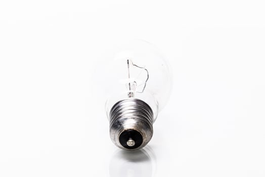 Close up of a light bulb on white background photo