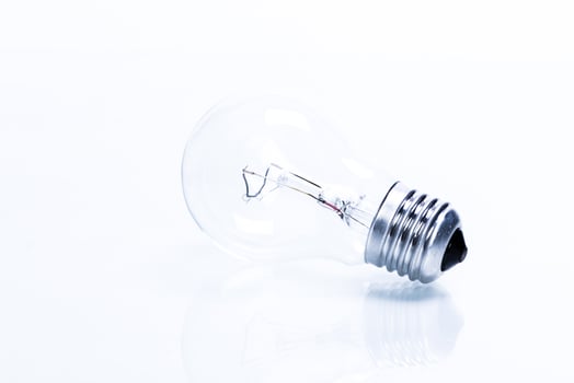 Close up of a light bulb on white background photo