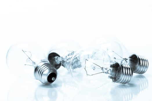 Many lightbulbs on white background close up photo