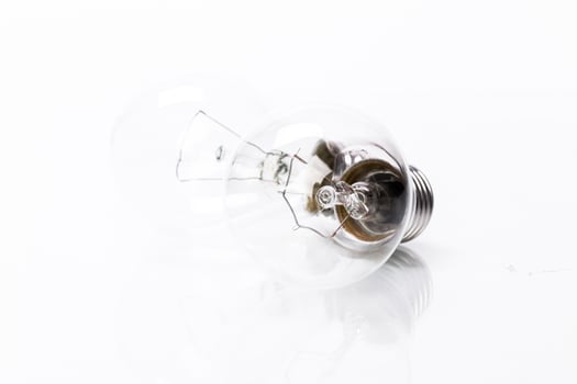 Close up of a light bulb on white background photo