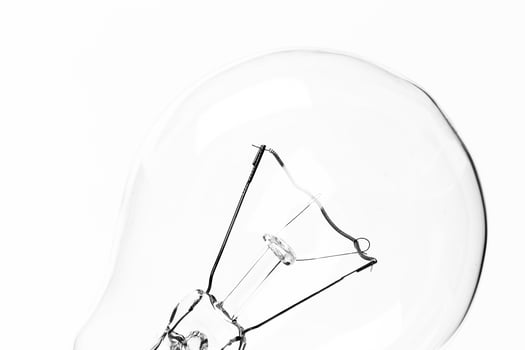 Lightbulb on white background, close up shot photo