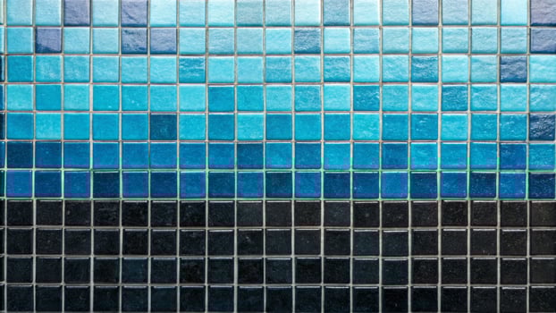 Cyan mosaic tiles overlay blue and black shades in a contemporary setting captured from an artistic perspective photo