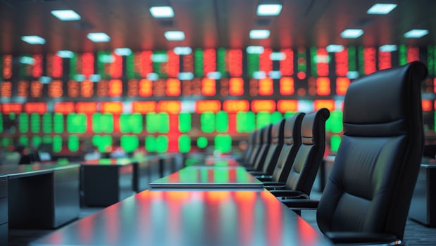 Trading floor with glowing screens displaying stock market data in a financial center during business hours photo