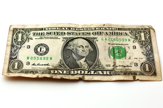 Close-up of a worn one dollar bill featuring George Washington, capturing the intricate details and texture of the currency. photo
