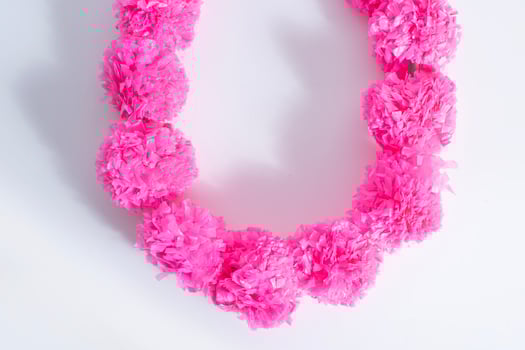 A necklace made out of pink tissue paper photo